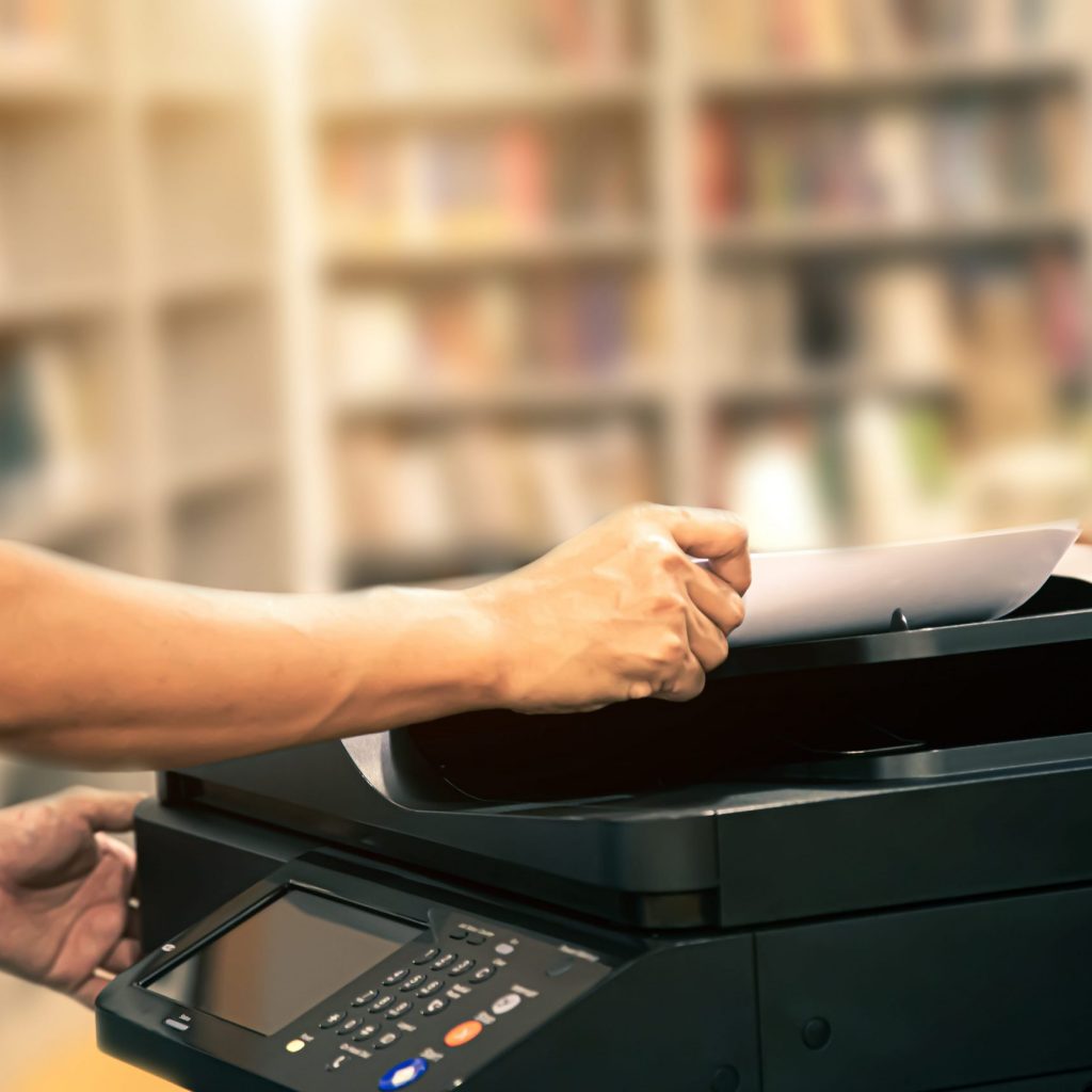 close-up-hand-office-man-using-copier-min